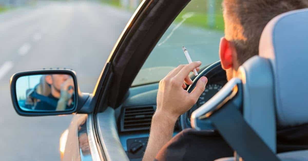 A man smoking while driving
