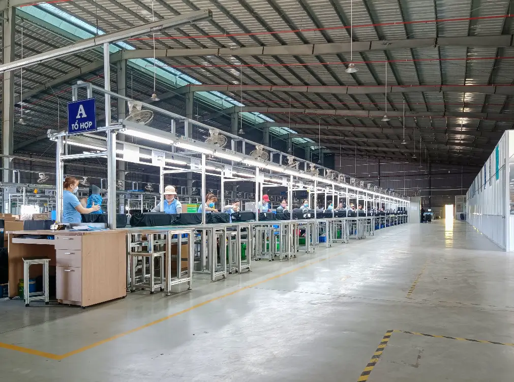 Workers assembling air purifiers on the production line at HisoAir’s Vietnam factory