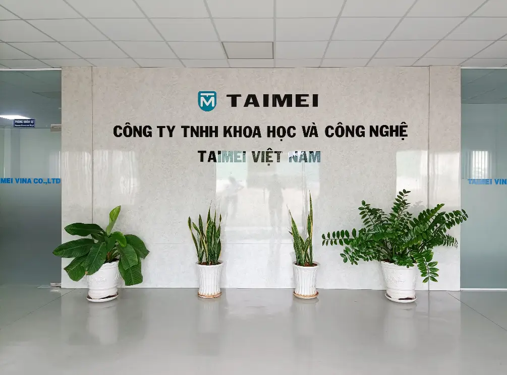 Reception area of HisoAir Vietnam factory with company logo and decorative plants.