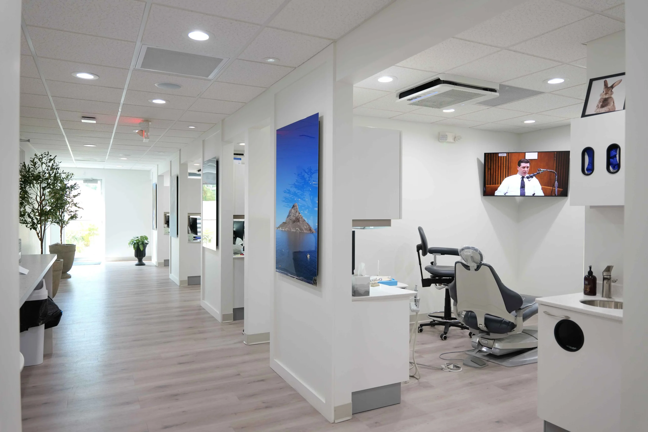 A modern nail salon with a wall-mounted air purifier and elegant decor.