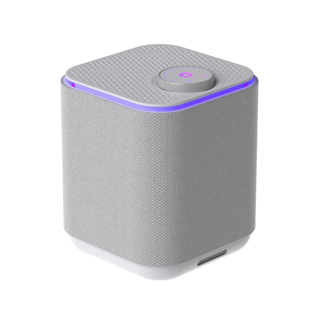 A small, modern, gray smart speaker with a textured surface, circular button on top, and glowing purple LED light.