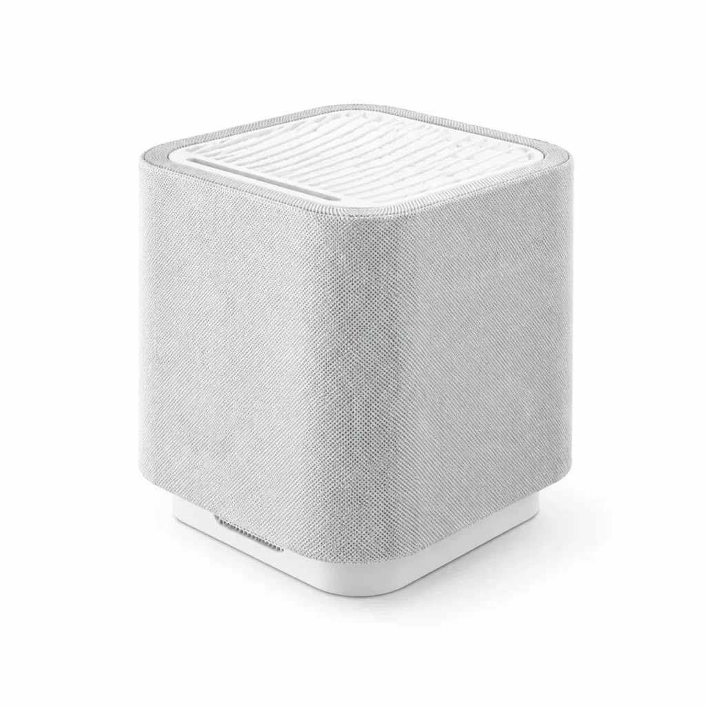 A modern gray air purifier with a minimalist design and textured fabric exterior, featuring a top air vent for filtration.