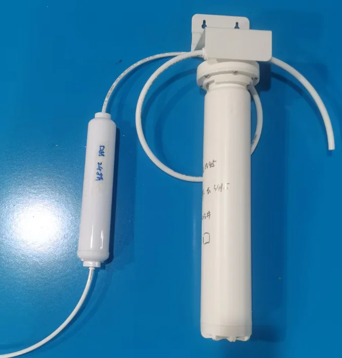 White water filter components including a cylindrical filter tube and a smaller attachment on a blue background.